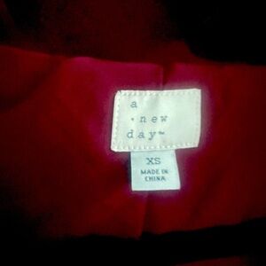 Maroon fur coat. Never been worn.